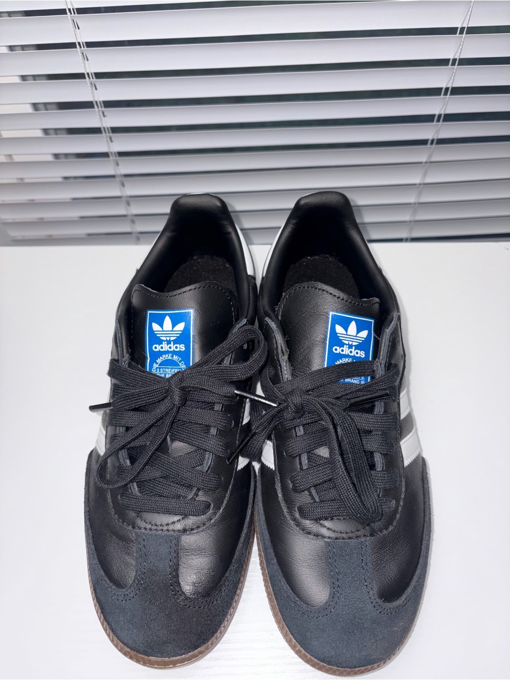 adidas Men’s Black & White Classic Sneakers with Blue Logo